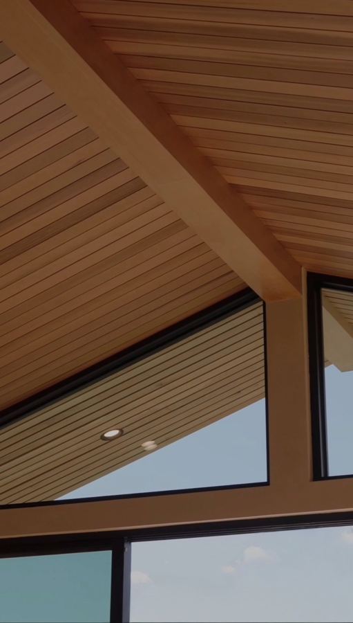 Wood-clad ceiling and exposed beam