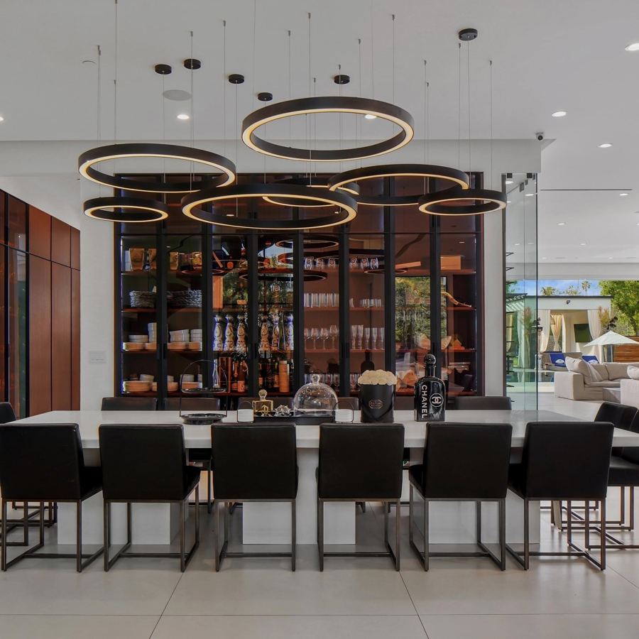 Bar seating under sculptural rings