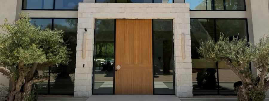 Stone entry surround and solid wood door