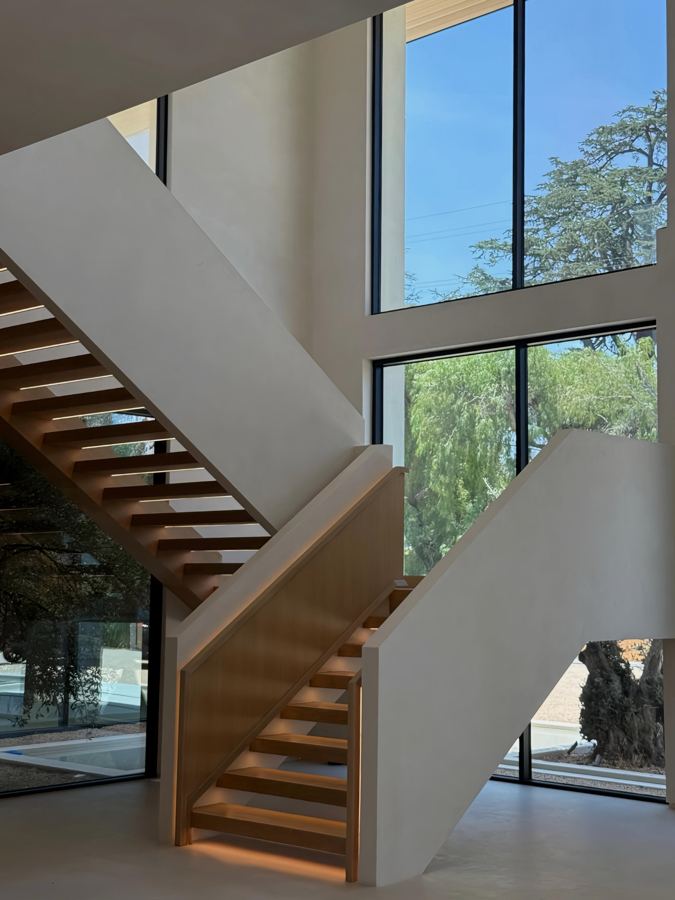 Stair, oak treads and full-height glazing