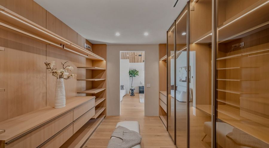 Glass-encased walk-in closet